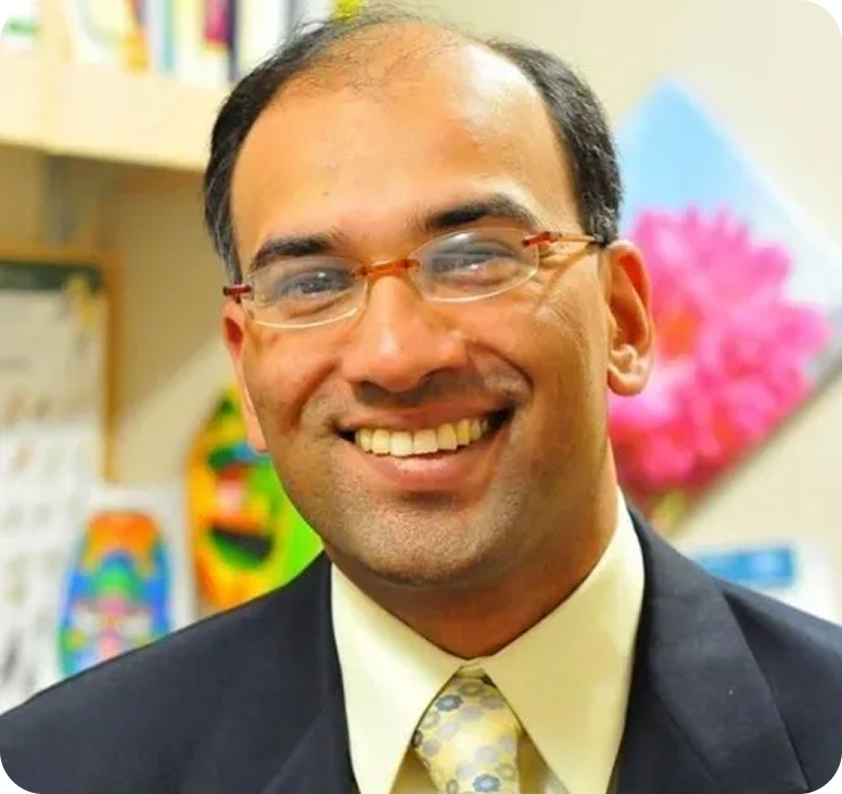 Professional portrait of a smiling man.