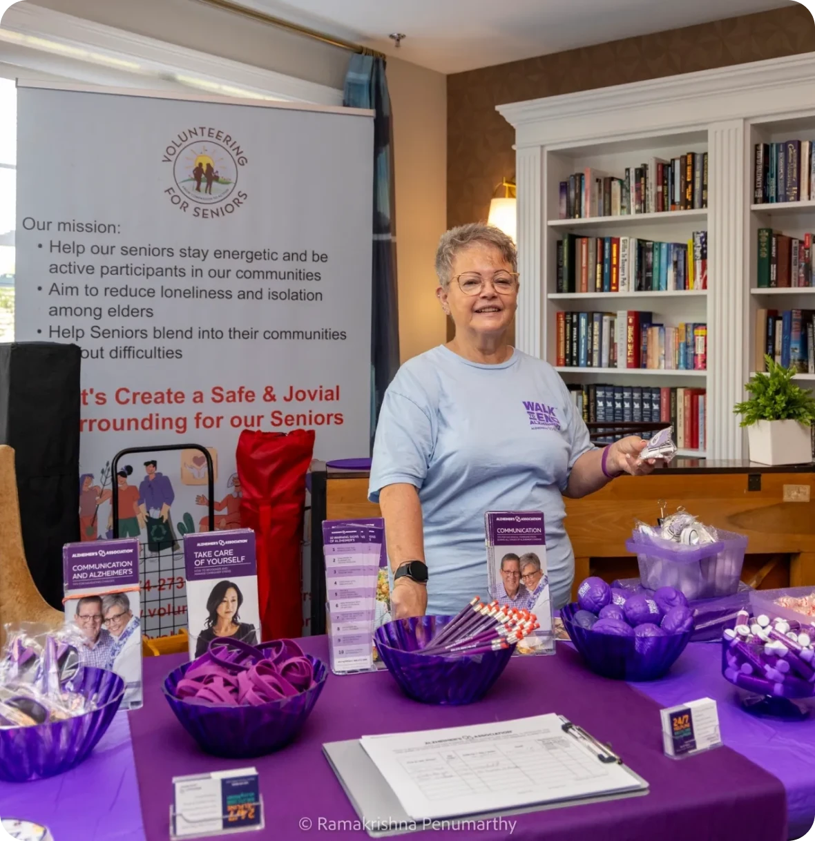 Woman at senior volunteer information table