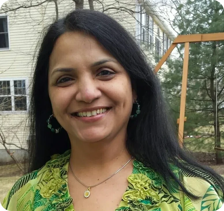 Smiling woman outdoors near swing set