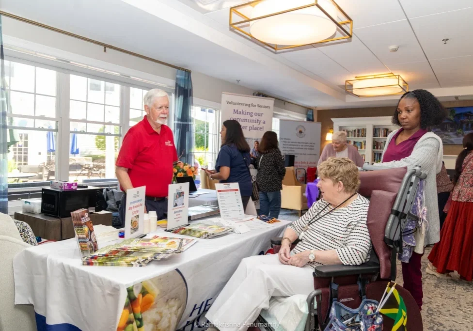 Woman in wheelchair talking to exhibitor