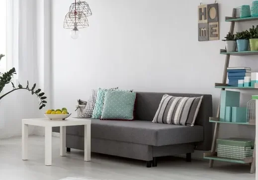 Cozy room featuring ladder shelf and couch