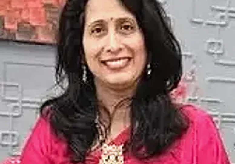Woman with long black hair smiling