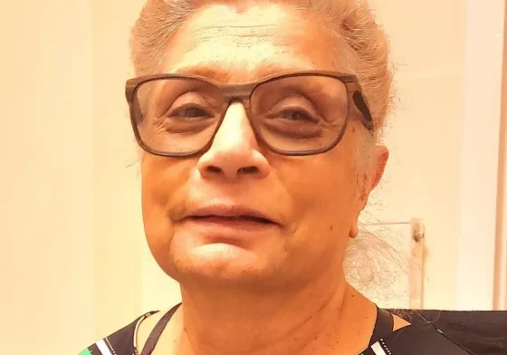 Senior wearing patterned blouse and glasses